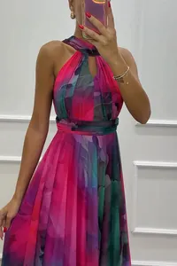 Elegant halter neck sleeveless maxi dress featuring a vibrant pink watercolor print