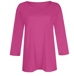 Detailed view of a vibrant magenta V-neck T-shirt with 3/4 sleeves for women.