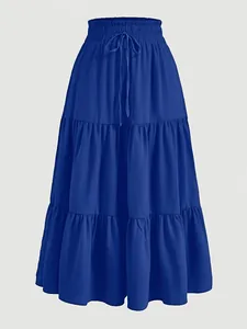 Close-up detail of a vibrant royal blue tiered plus size cake skirt with elastic waistband.
