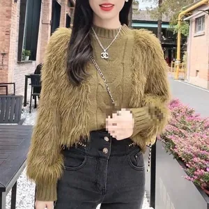 Stylish women's olive green sweater with fuzzy faux fur sleeves and cable knit design