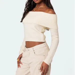 Elegant solid cream off-the-shoulder long sleeve knitted sweater top for women's wear.