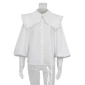 Detailed front view of a white French-style doll collar blouse with lantern sleeves