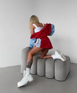Fashionable women's two-piece colorblock tracksuit with red zip-up jacket and mini skirt set