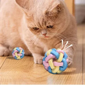 Close-up view of a colorful TPR woven ball used for cat and dog interactive dental play