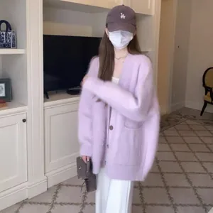 Detailed view of lavender imitation mink fur oversized cardigan on model