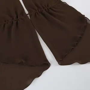 Detailed macro view showing the texture of brown chiffon ruffles with delicate hem stitching