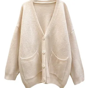 Oversized V-neck knitted cardigan with pockets in cream color for women