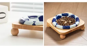 Detail showing ceramic pet bowl with blue checkerboard pattern and oak wood stand
