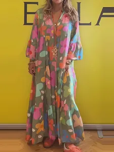 Bohemian floral print long sleeve maxi dress with loose fit and flared hemline.