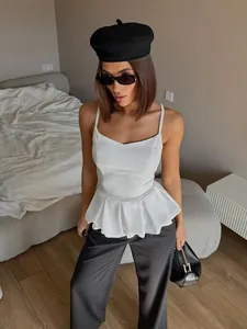 Satin sleeveless camisole top in white with elegant peplum waist for summer fashion look