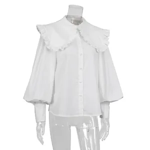 Front view of white cotton shirt with large ruffled Peter Pan collar and lantern sleeves