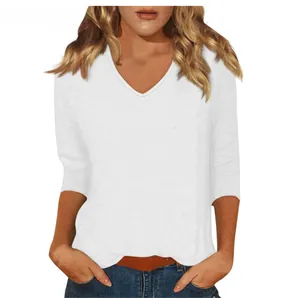 Detail of a casual white V-neck women's top featuring soft three-quarter sleeves