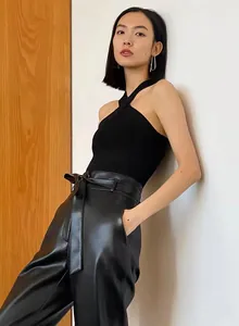 Sleeveless black halter neck knitted top with cross strap design for modern women fashion