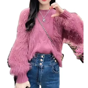 Elegant pink cable knit sweater featuring fluffy faux fur sleeves for stylish autumn winter wear.
