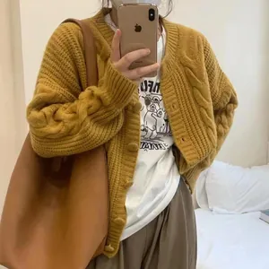 Oversized mustard yellow cable-knit cardigan sweater for women in retro design