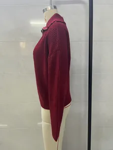 Side view of a maroon vintage oversized V-neck ribbed knit sweater on a mannequin