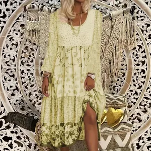 Bohemian long sleeve floral print maxi dress with a tiered skirt and round neck