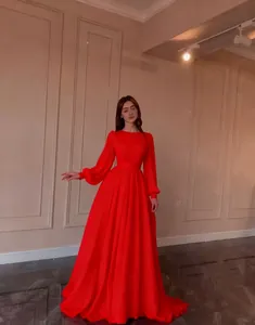 Full view of an elegant red French palace style chiffon gown with long bishop sleeves