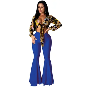 Sexy baroque print tie-front crop top paired with royal blue flared trousers outfit