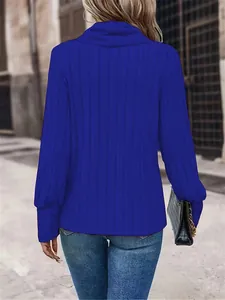 Back view of women's ribbed long sleeve top in vibrant blue with high neck design