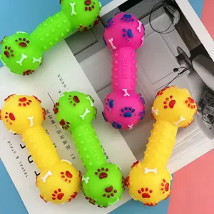 Colorful squeaky dumbbell dog toy for teething and cleaning teeth in lifestyle setting
