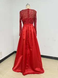 Back view of a red floor-length evening gown with sequined bodice and satin skirt