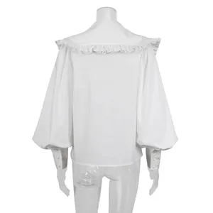 Back view detail of white French doll collar shirt with ruffles and puff sleeves