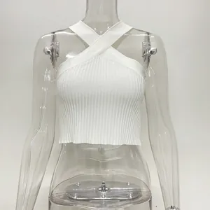 Detailed macro view showing the fine ribbed texture of this white criss-cross halter neck crop top