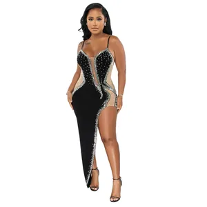 Sexy black evening dress with sheer mesh panels and sparkling rhinestone details