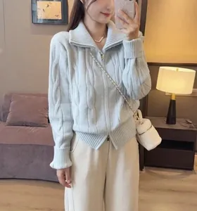 Women's light blue cable knit sweater with double zipper and high collar casual style