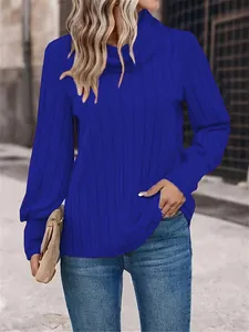 Close-up detail of vibrant blue ribbed long sleeve turtleneck top for autumn and winter fashion