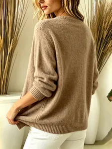 Back view of a cozy brown knit sweater with detailed ribbing on the cuffs and hem.