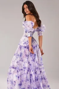 Exquisite detail view of a floral organza off-shoulder maxi evening dress from the back