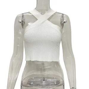 Front view of white ribbed knit halter cross crop top presented on a clear mannequin