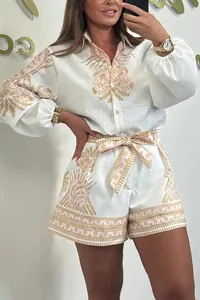 Detailed view of a women's two-piece set with long sleeve shirt and printed shorts.