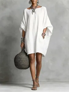 Loose white batwing-sleeve bohemian dress made of textured faux linen cotton fabric
