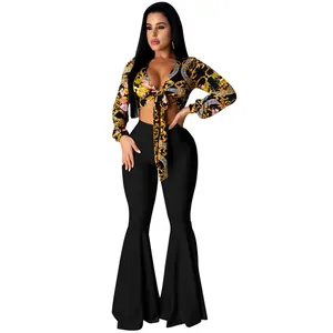 Sexy two-piece outfit with baroque floral print crop top and black ruffled flare pants