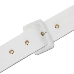 Close-up detail of a white fabric belt featuring a square buckle and gold grommets