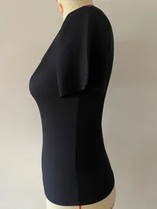 Macro view of black ribbed knit texture on a slim-fit women's short-sleeve top