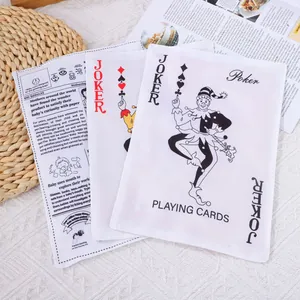 Detail view of crinkle dog toys in newspaper and joker card designs for pet teething.