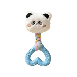 Detail showing a heart-shaped silicone teether with plush panda head dog toy