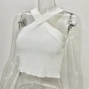 Close-up of white ribbed halter-neck crop top with criss-cross design on mannequin