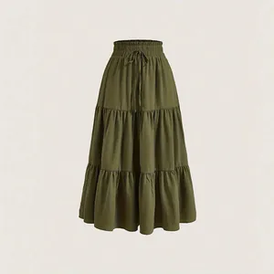 Olive green plus size tiered maxi skirt with a high elastic waist and drawstring detail