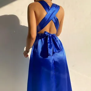 Rear view detail of a royal blue satin backless evening dress with criss-cross halter straps