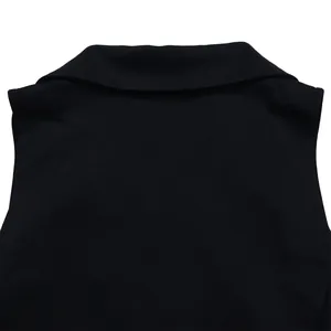 Close-up macro view of an elegant black blazer collar detail on a sleeveless jumpsuit