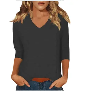 Detail of women's casual V-neck T-shirt with 3/4 sleeves in dark grey color.