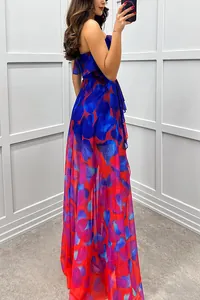 Side view of elegant mesh strapless maxi dress with vibrant blue and red floral print