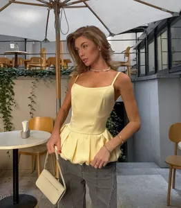 Elegant yellow satin sleeveless peplum camisole top with slim fit design for women