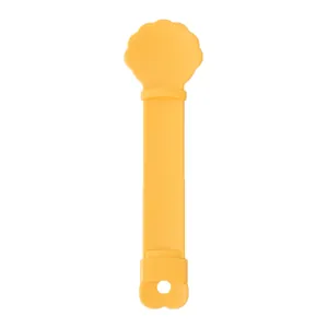 Presse-friandise jaune et cuillère de nourrissage pour chat et collations