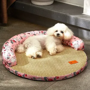 Round pink floral pet cooling mat with woven center and padded bolster for dogs